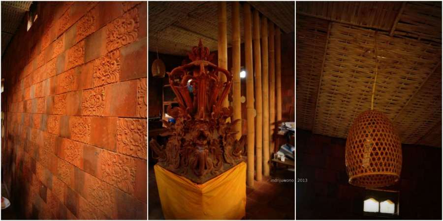 dinding bermotif, patung dan kap lampu pengumpul terang