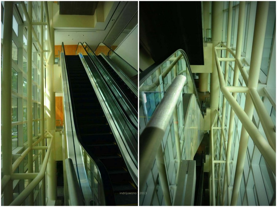 sisi eskalator dengan jendela curtain glass dan back mullion